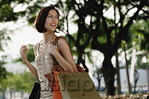 AsiaPix - A woman with lots of shopping bags