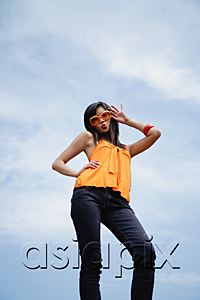 AsiaPix - A woman with large sunglasses poses for the camera
