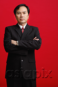 AsiaPix - A businessman crosses his arms