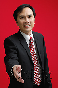 AsiaPix - A businessman extends his hand to shake hands