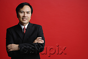AsiaPix - A businessman crosses his arms