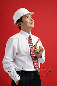 AsiaPix - A man wearing a shirt and tie with a hardhat