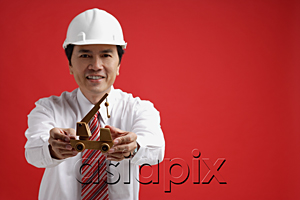 AsiaPix - A man wearing a shirt and tie with a hardhat