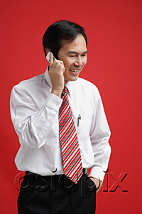 AsiaPix - A man smiles as he talks on a cellphone