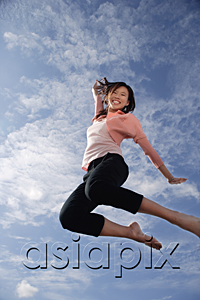 AsiaPix - A young woman jumps for joy