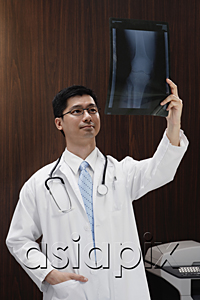 AsiaPix - A doctor holds up an x-ray