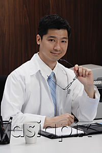 AsiaPix - A doctor sits at his desk