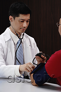 AsiaPix - A doctor examines a patient