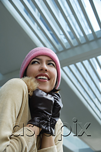 AsiaPix - A woman tries to keep warm in a hat and gloves