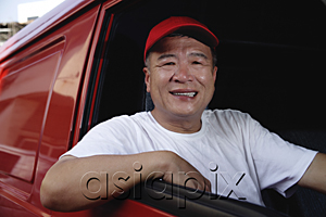 AsiaPix - A man in a red van smiles at the camera