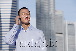 AsiaPix - A man talks on his cellphone outdoors