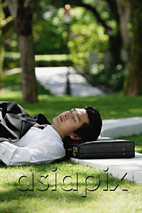 AsiaPix - A man lies down and has a rest in the park