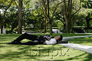 AsiaPix - A man lies down and has a rest in the park
