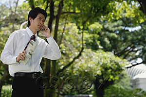 AsiaPix - A man talks on his cellphone in the park