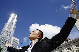 AsiaPix - A man in a suit with a skyscraper behind him