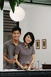 AsiaPix - A young couple smile at the camera together