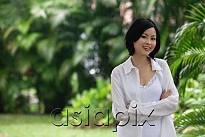 AsiaPix - A woman in a garden smiles at the camera
