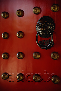 AsiaPix - Brass lion head door knocker at temple