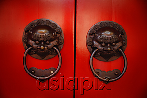 AsiaPix - Pair of brass lion head door knockers at temple