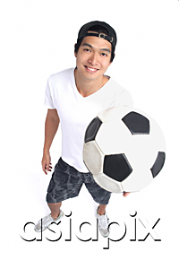 AsiaPix - A man holds a soccerball and smiles at the camera