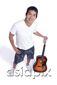 AsiaPix - A man holds a guitar and smiles at the camera