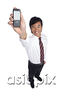 AsiaPix - A man smiles at the camera as he holds out his cellphone