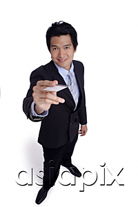 AsiaPix - A man in a suit holds out his business card to the camera