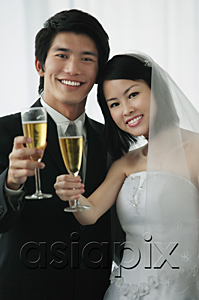 AsiaPix - A newlywed couple smile at the camera