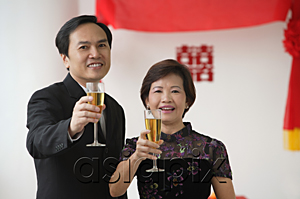 AsiaPix - A couple raise their glasses for a toast