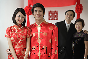 AsiaPix - A newlywed couple and their family smile at the camera together
