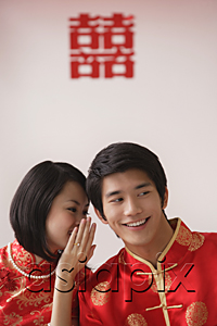 AsiaPix - A newlywed couple whisper to each other