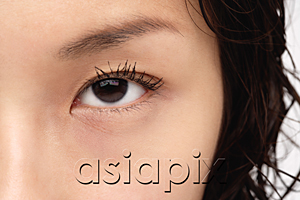 AsiaPix - A close-up of a young woman looking at the camera