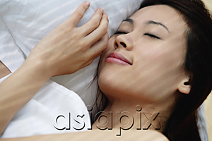 AsiaPix - A woman asleep in bed