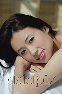 AsiaPix - A woman looks at the camera as she has a relaxing massage