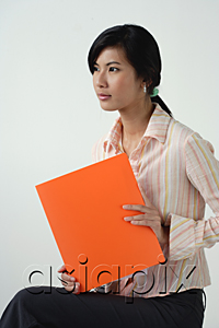 AsiaPix - A woman with an orange folder