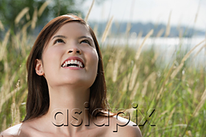 AsiaPix - Woman standing in long grass