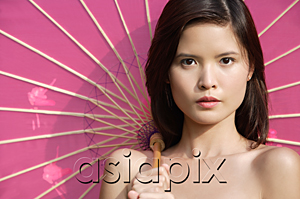 AsiaPix - Woman with pink parasol looking at camera