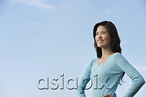 AsiaPix - Woman smiling while looking into the distance