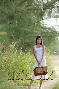 AsiaPix - Woman with basket looking at camera