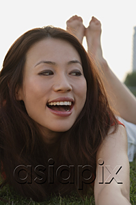 AsiaPix - Woman laughing and looking sideways