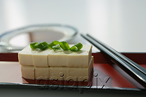 AsiaPix - Still life of stacks of sliced beancurd with spring onion