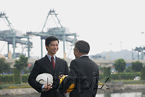 AsiaPix - Businessmen with helmets having a conversation