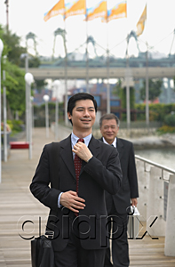 AsiaPix - Businessmen walking on pier