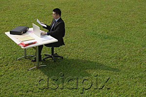 AsiaPix - Businessman working at desk