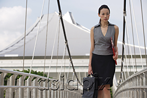 AsiaPix - Businesswoman walking while looking into distance