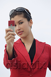 AsiaPix - Woman taking picture with mobile phone