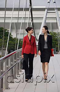 AsiaPix - Businesswomen walking together while talking
