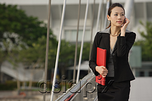 AsiaPix - Businesswoman talking on the mobile phone