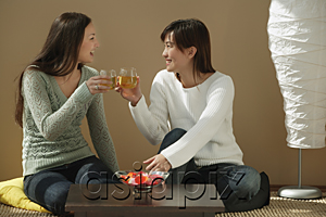 AsiaPix - Friends toasting and looking at each other