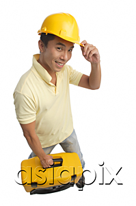 AsiaPix - Builder with tool box smiling at camera